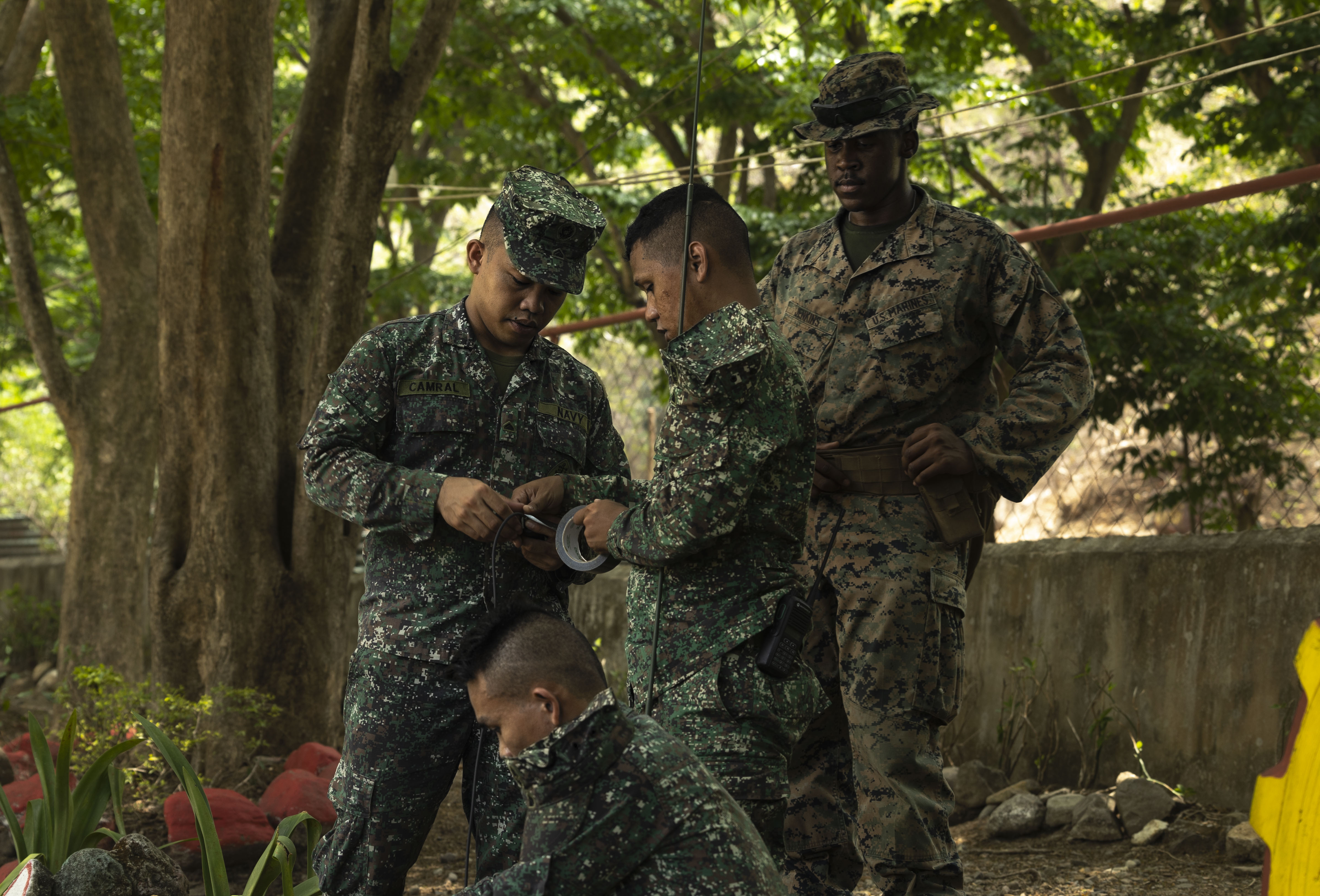 U.S. Marine Corps Cpl. Niles J. Jenkins, right, a radio operator, with Headquarters Battalion, 3d Marine Division, conducts radio communications training with Philippine Marines during Balikatan 23 at Marine Base Gregorio Lim, Philippines, April 18, 2023. Balikatan 23 is the 38th iteration of the annual bilateral exercise between the Armed Forces of the Philippines and the U.S. military. The exercise includes three weeks of training focused on amphibious operations, command and control, humanitarian assistance, urban operations and counterterrorism skills throughout northern and western Luzon. Coastal defense training figures prominently in the Balikatan 23 training schedule. Niles is a native of Baltimore, MD.