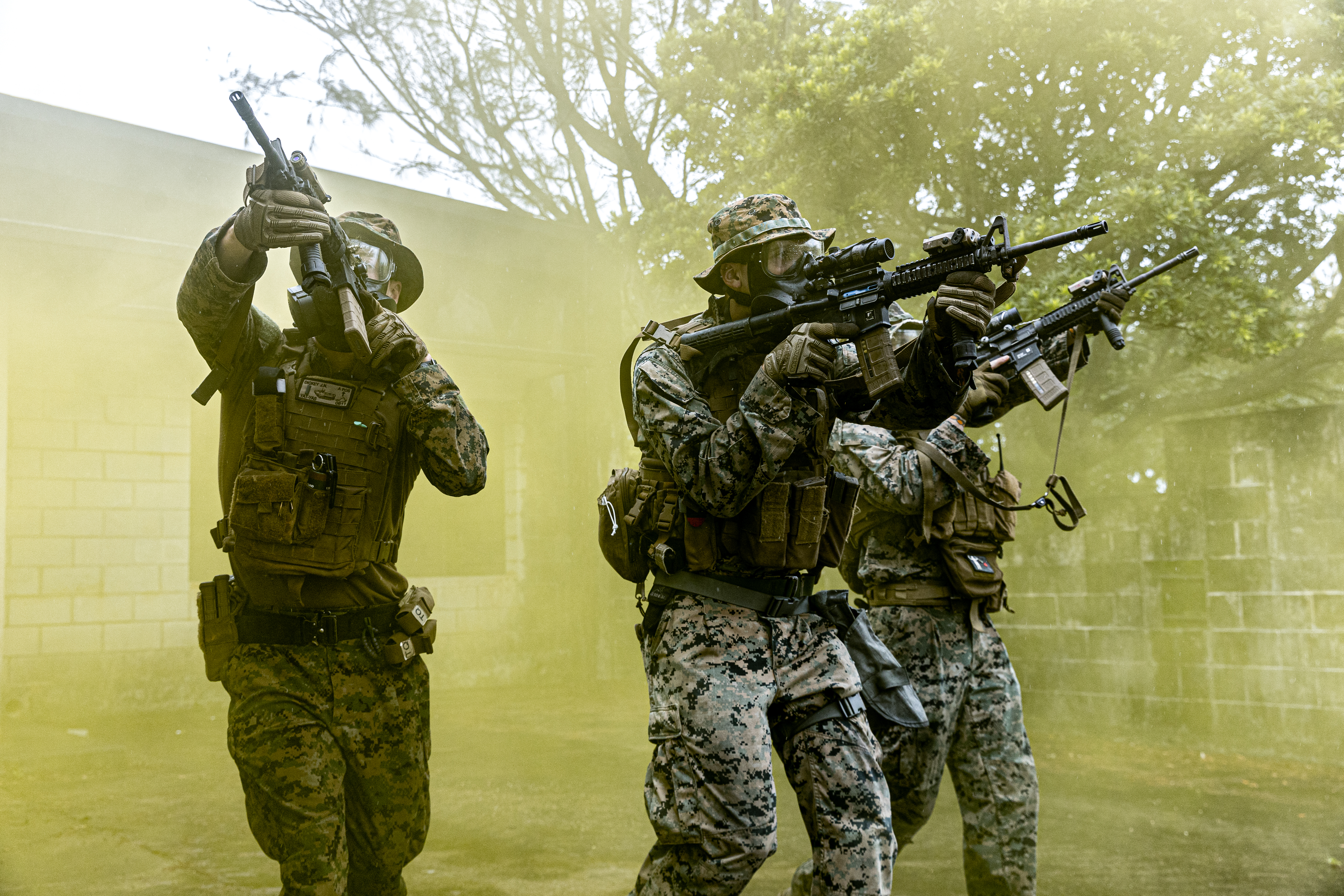 U.S. Marines maneuver through smoke during Exercise Samurai 23-3 on Okinawa, Japan, July 27, 2023. The exercise allowed the Marines to maintain tactical proficiency and lethality. The Marines are with Headquarters Battalion, 3d Marine Division.