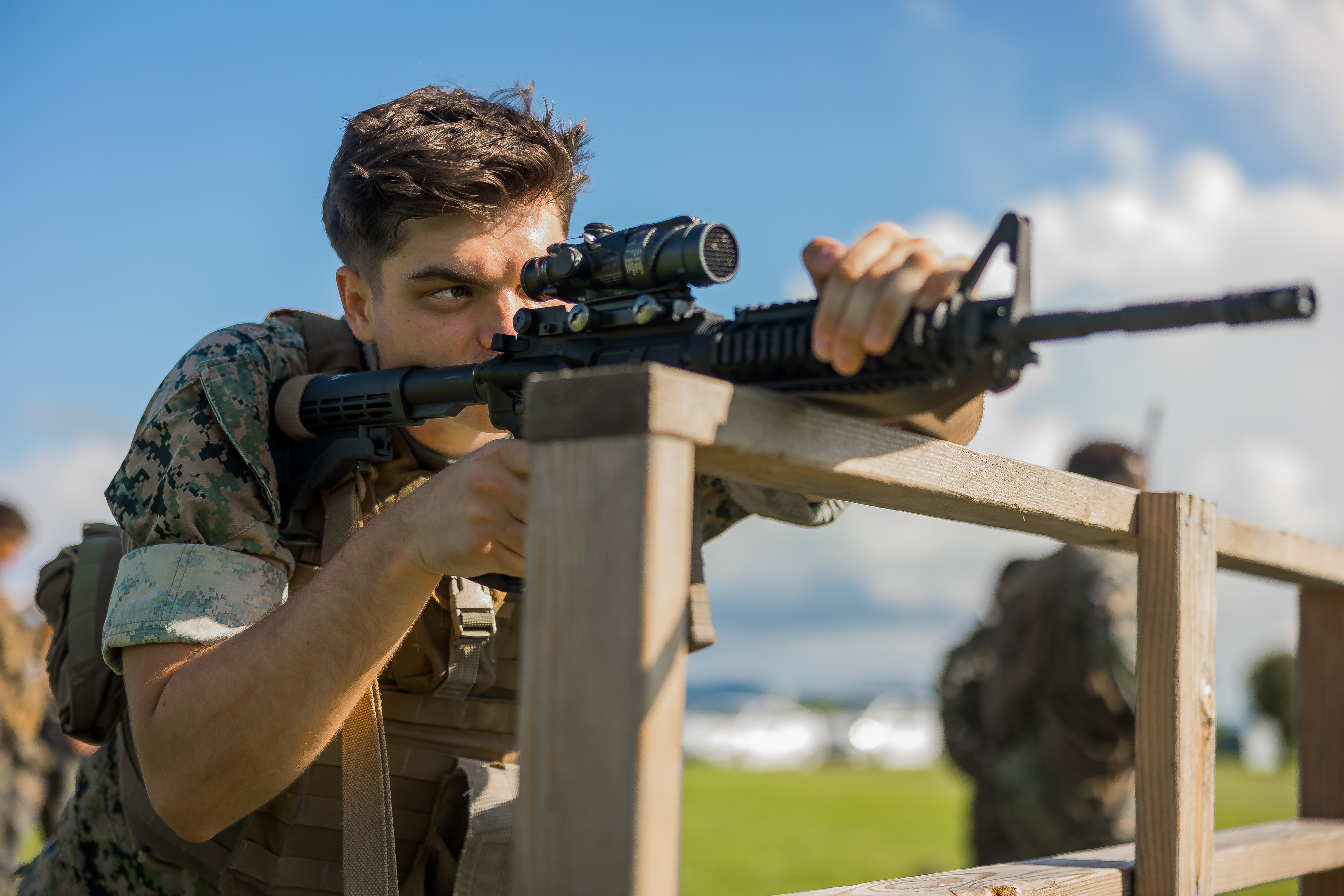 A U.S. Marine sights in with an M4 carbine during an annual rifle qualification grass week on Camp Courtney, Okinawa, Japan, Sept. 19, 2023. Grass week is a week-long course designated to practice and perform basic rifle fundamentals prior to qualifying for annual marksmanship. The Marine is with Headquarters Battalion, 3d Marine Division.